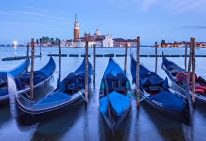 Floating On Water Prints: Gondolas moored at night in the Bacino di San Marco (St. Marks Basin), waterfront