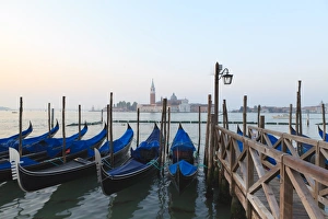 Gondolas moored by Riva degli Schiavoni, looking towards San Giorgio Maggiore