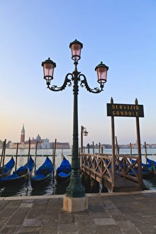 Gondolas moored by Riva degli Schiavoni, looking towards San Giorgio Maggiore