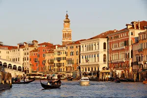 Bell Tower Prints: Gondolier on gondola on Grand Canal at sunset, Venice, UNESCO World Heritage Site