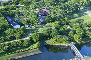 Hokkaido Prints: Goryokaku Palace sits within Goryokaku Park surrounded by trees and water in Hakodate