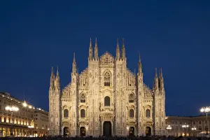 Milan Prints: Gothic spires on the facade of the Milan Cathedral in the Piazza del Duomo at dusk, Milan