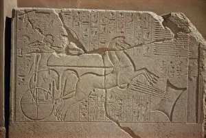 Chariot Prints: Granite slab showing Tutmose IV shooting arrows through lead pillow, Luxor Museum