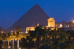 The Great Pyramid, UNESCO World Heritage Site, and the Mena House Hotel in Giza at night, near Cairo, Egypt