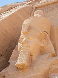 Abu Simbel Prints: Detail of The Great Temple of Abu Simbel with its iconic 20 meter tall seated colossal statues of Ramses II