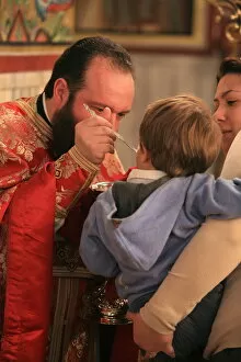 Images Dated 20th April 2006: Greek Orthodox boy receiving the Eucharist, Thessaloniki, Macedonia, Greece, Europe