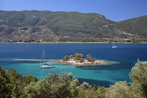 Russian Prints: Greek Orthodox church on small island with anchored yacht off Russian Bay with crystal clear turquoise water