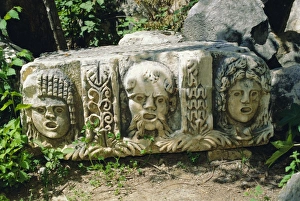 Disguise Prints: Greek tragic masks scattered among the ruins of ancient Myra