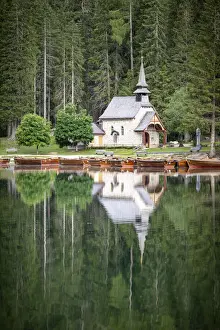 Pine Tree Prints: Green forest and chapel perfectly reflected in Lake Braies (Pragser Wildsee) in summer