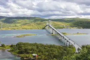 Green hills and turquoise sea frame the suspension road bridge in Tjeldsundbrua, Troms county