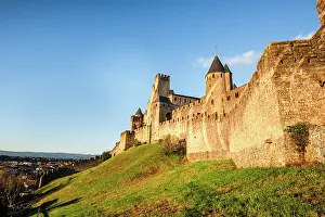 Hilly Prints: Green hilly slope and the stone fortification of the Medieval castle of Carcassonne