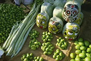 Vege Table Prints: Green mangoes, snake gourds and squash painted with faces to hang in shop front to keep off evil spirits