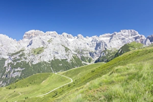 Pinzolo Prints: Green meadows frame the high rocky peaks, Doss Del Sabion, Pinzolo, Brenta Dolomites