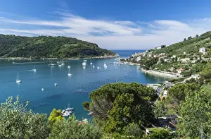 Gulf Prints: Green vegetation frames the turquoise sea of the Gulf of Poets surrounding Portovenere