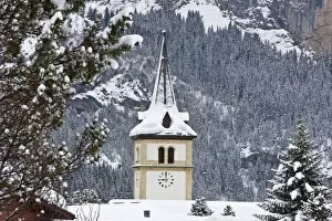 Grindelwald village church after a heavy fall of snow, Jungfrau region