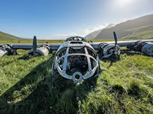 Uninhabited Prints: Grounded B-24 Liberator bomber wreckage in Bechevin Bay, Atka Island, during WWII