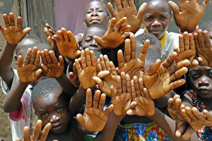 Kids Prints: Group of children showing their hands, Datcha-Attikpaye, Togo, West Africa, Africa