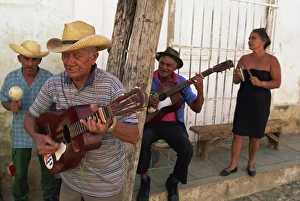 60 65 Years Prints: Group of three elderly men and a woman playing music, Trinidad, Cuba, West Indies