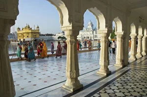 National Famous Place Collection: Group of Sikh women pilgrims walking around holy pool