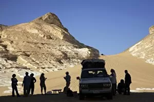 Group of travellers visiting the Black Desert, Egypt, North Africa, Africa