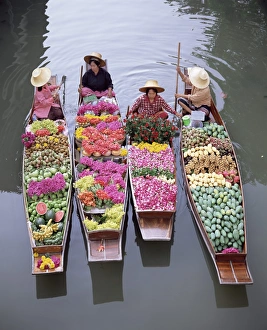 Paddling Prints: A group of four women market traders in boats laden