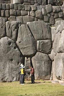 Images Dated 18th December 2005: Guide talking to tourists at the Inca fortification of Sacsayhuaman, near Cuzco