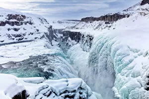 Flowing Gallery: Gullfoss Waterfall, partly frozen in winter, Gullfoss, Iceland, Polar Regions