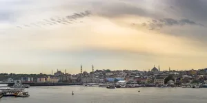 Traditionally Turkish Prints: Hagia Sophia and New Mosque seen across Golden Horn at sunset, Istanbul, Turkey, Europe