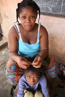 Girls Prints: Hairdresser at home, Lome, Togo, West Africa, Africa