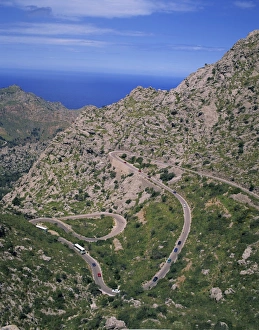 Curving Prints: Hairpin bends on winding road up a rocky hill at La Alobra