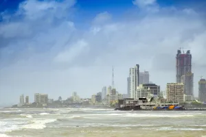 Meteorological Prints: The Haji Ali mosque and the skyline of central Mumbai under monsoon seas, Mumbai (Bombay)