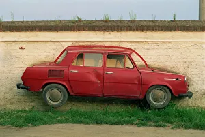 Humor Prints: Half a Skoda on a wall in a car salesyard near Piestany
