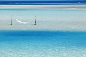 Images Dated 17th May 2010: Hammock hanging in shallow clear water, Maldives, Indian Ocean, Asia