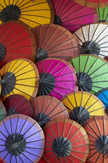Images Dated 20th December 2010: Handmade paper umbrellas in the night market, Luang Prabang, Laos, Indochina