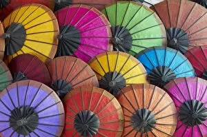 Images Dated 20th December 2010: Handmade paper umbrellas in the night market, Luang Prabang, Laos, Indochina
