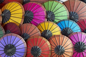 Images Dated 20th December 2010: Handmade paper umbrellas in the night market, Luang Prabang, Laos, Indochina