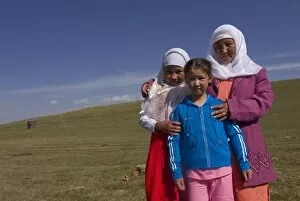 Happy nomad mother and daughters, Song Kol, Kyrgyzstan, Central Asia, Asia