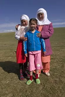 Happy nomad mother, Song Kol, Kyrgyzstan, Central Asia, Asia