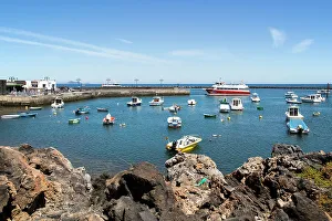 Harbour and ferry boat in the fishing village of Orzola, Lanzarote, Canary Islands, Spain, Atlantic, Europe