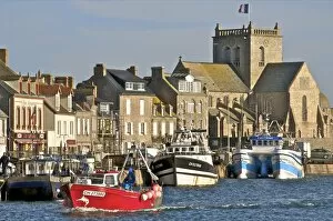 Images Dated 19th November 2009: Harbour and fishing boats with houses and church in the background, Barfleur