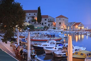 Brac Prints: Harbour lit up at dusk, Bol, Brac Island, Dalmatian Coast, Croatia, Europe