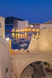 Fortified Wall Prints: Harbour and Old City Walls at dusk