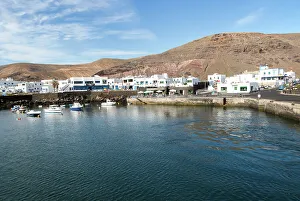 Fishing Village Prints: Harbour and white houses in the fishing village of Orzola