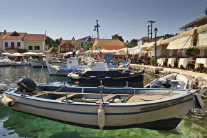 Rowing Boat Prints: Harbourside with boats, cafes and clear green water