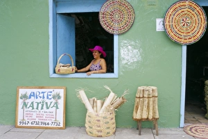 Small Business Prints: Hat seller in the window of her shop, Barreirinhas, Lencois Maranhenses