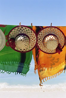 Head Piece Prints: Hats and batiks hanging on a line