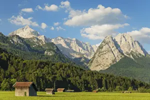 Hay barns at Hammersbach Footpath against Wetterstein Mountain Range