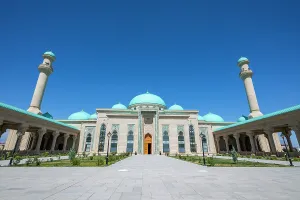 Worship Prints: Haydar Mosque stands tall with its large dome and minarets under a clear blue sky in Nakhchivan