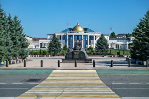 Roads Prints: Headquarters of the Republic of Ingushetia located in Magas with a statue in front during clear weather