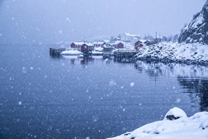 Blurry Prints: Heavy snowfall on the fishing village and the icy sea, Nusfjord, Lofoten Islands